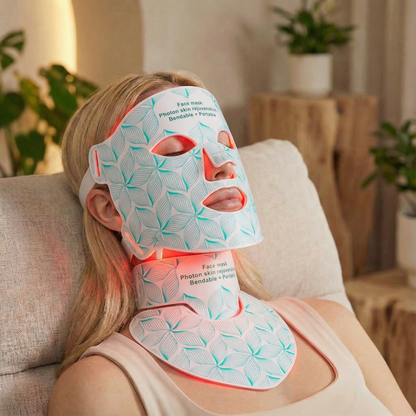 Woman wearing a LED face and neck mask in a home setting