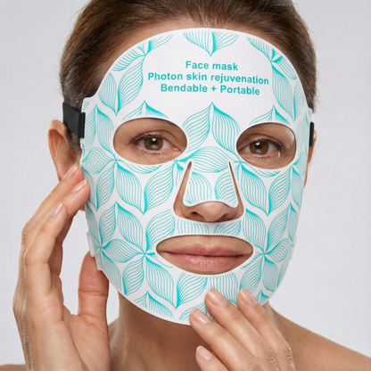 Woman wearing a face mask with leaf pattern and text on a white background