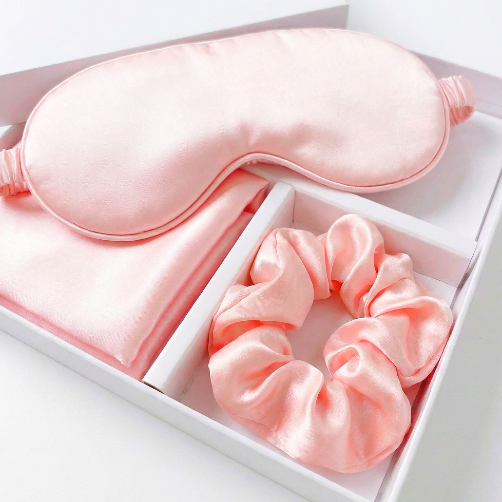 Pink eye mask and scrunchie set in a white box